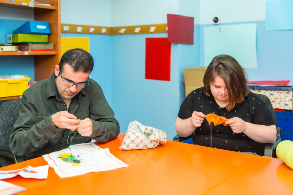 people working on knitting and embroidery