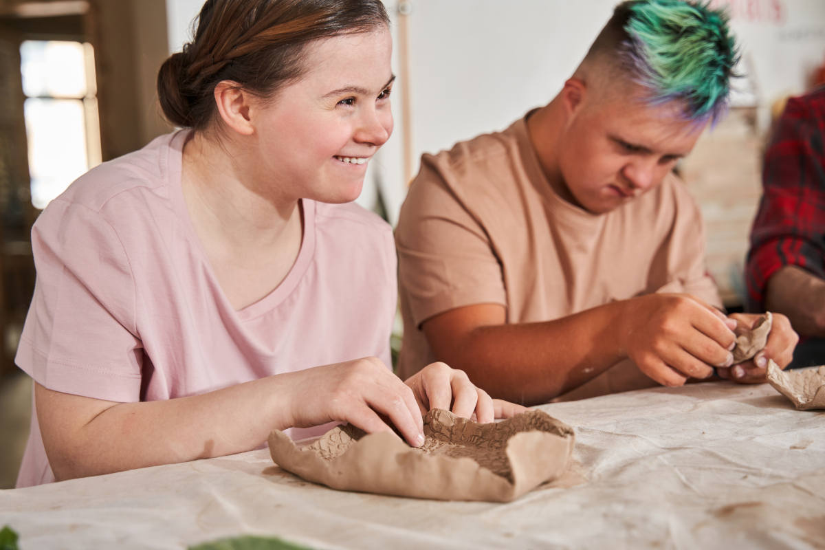 people enjoying pottery class